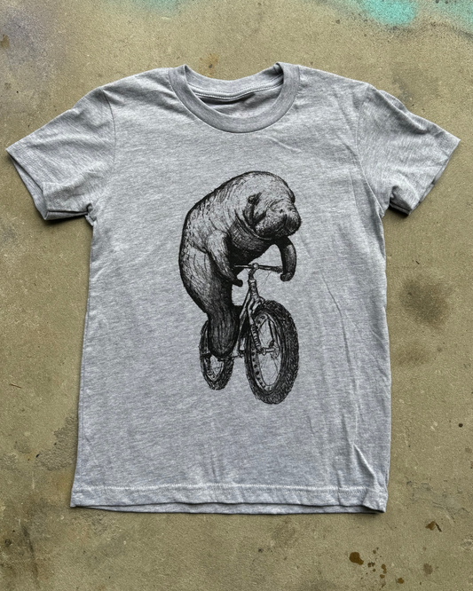 Manatee on a Bicycle Kids T-Shirt