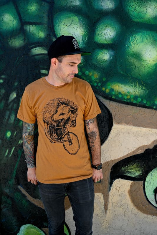Opossum on a Bicycle Men’s/Unisex T-Shirt - T-Shirt / Camel Orange / XS - Unisex Tees