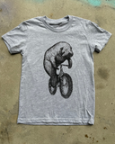 Manatee on a Bicycle Kids T-Shirt